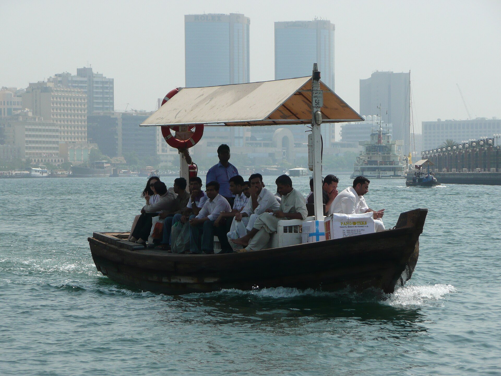 Abra carrying passengers across Dubai Creek within Dubai, United Arab Emirates.