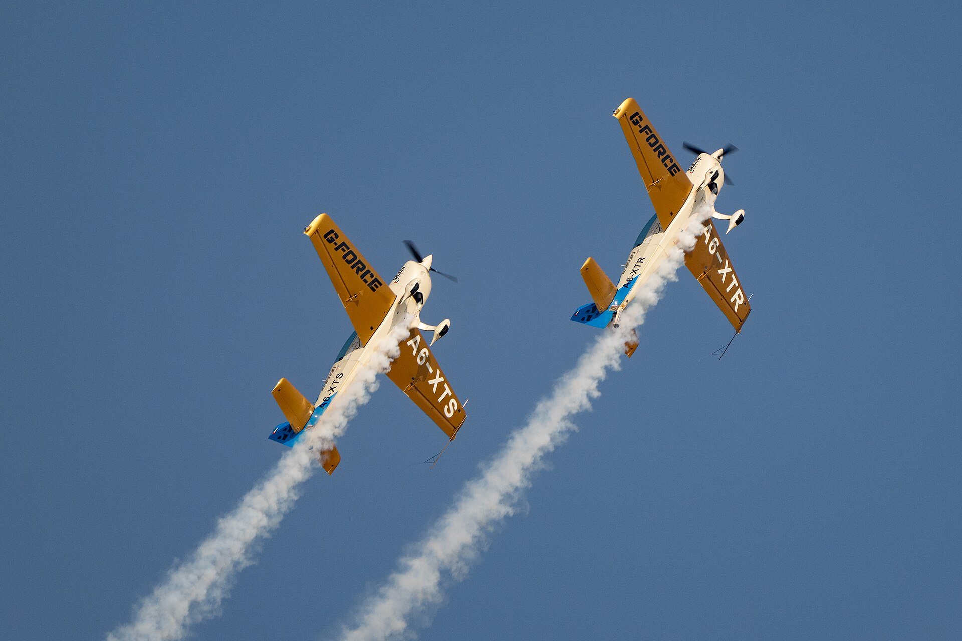 Extra 330LT aircraft with a United Arab Emirates aviation experience company perform an aerial demonstration Nov. 15, 2025, in preparation for the Dubai Airshow 2025 at the Al Makt