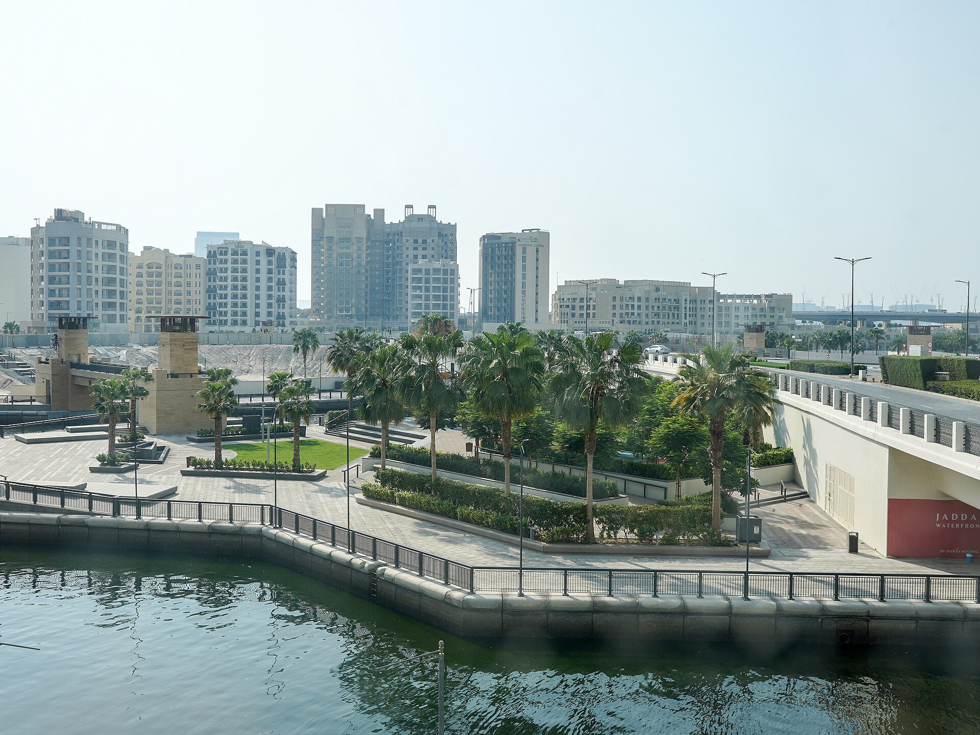 View from Ink Hotel: Exercise park in the coconut grove. Inlet of Dubai Creek, skyline of Jaddaf Waterfront, Dubai, UAE