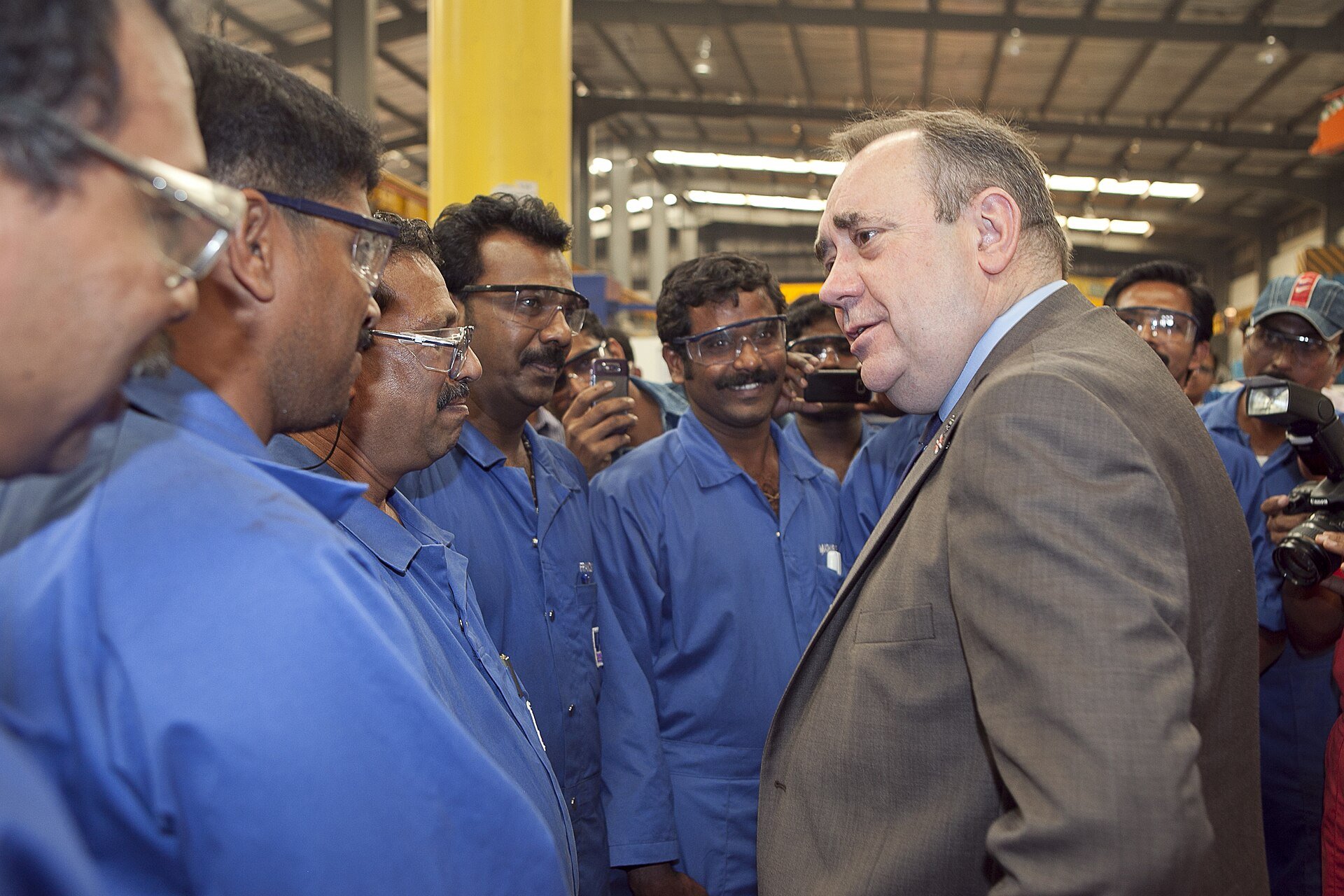 First Minister Alex Salmond chats with technicians during a tour of the Weir Oil and Gas facility in Dubai. While visiting, the FM also saw plans for the company's new HQ which wil