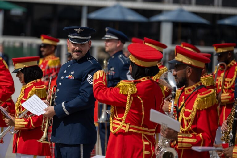 U.S. Air Force Airmen assigned to the 9th Air Force (Air Forces Central) Band and United Arab Emirates Armed Forces Band members prepare for a performance on the opening day of the