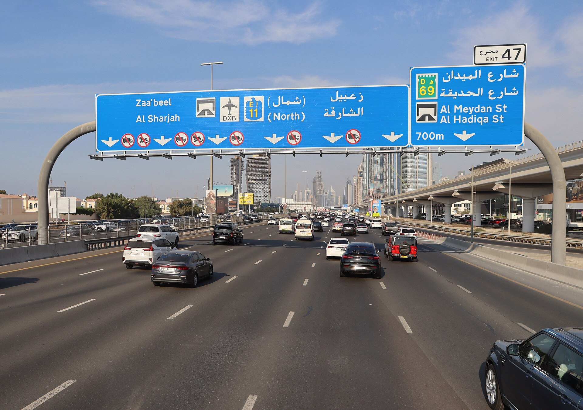 Northeast-bound traffic on the E 11 road in the United Arab Emirates, also known as Sheikh Zayed Road, near Exit 47 for Al Meydan Street and Al Hadiqa Street in Dubai. Photographe