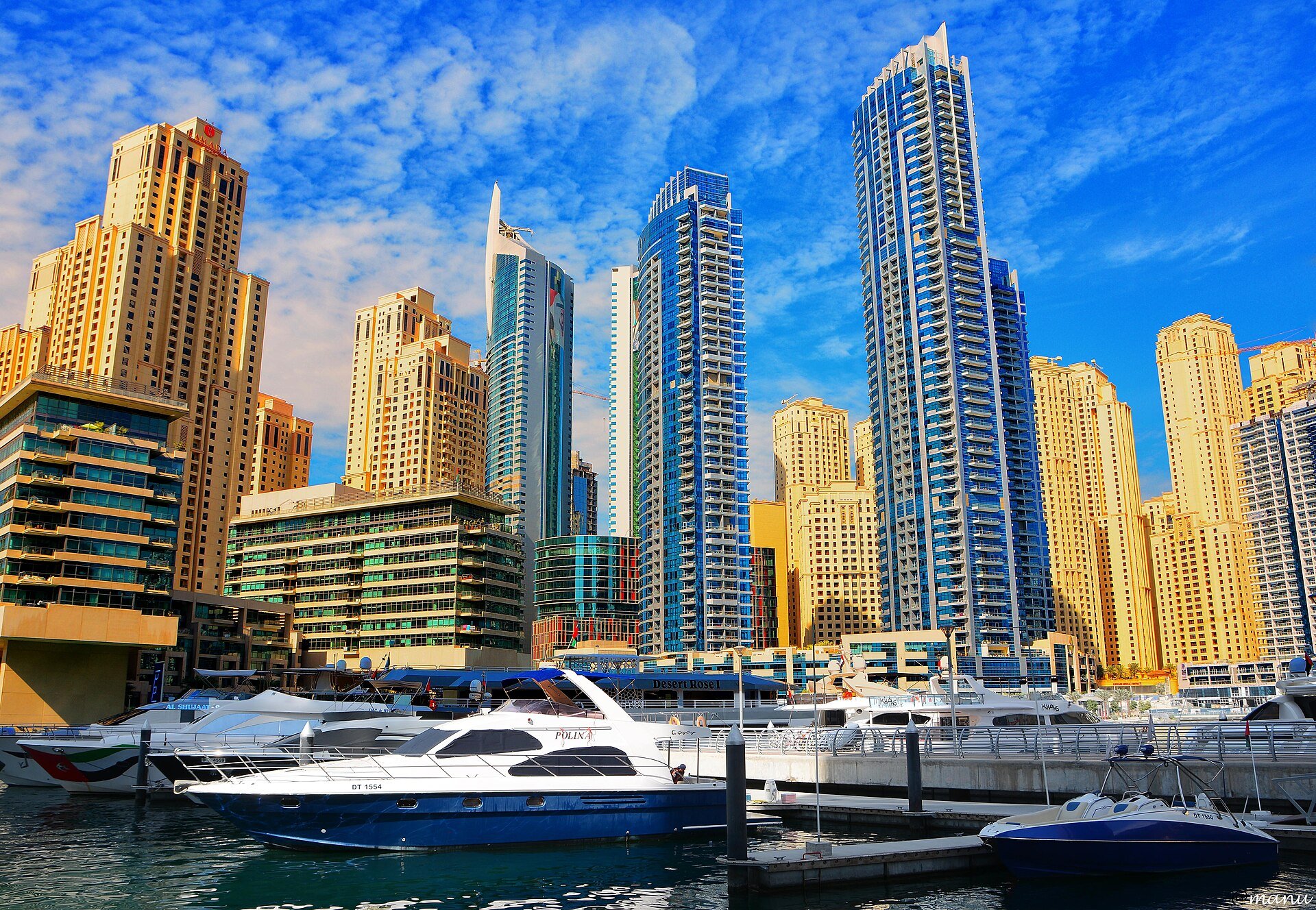 Dubai Marina is a district in Dubai, United Arab Emirates. Dubai Marina is an artificial canal city, built along a two-mile (3 km) stretch of Persian Gulf shoreline. When the entir