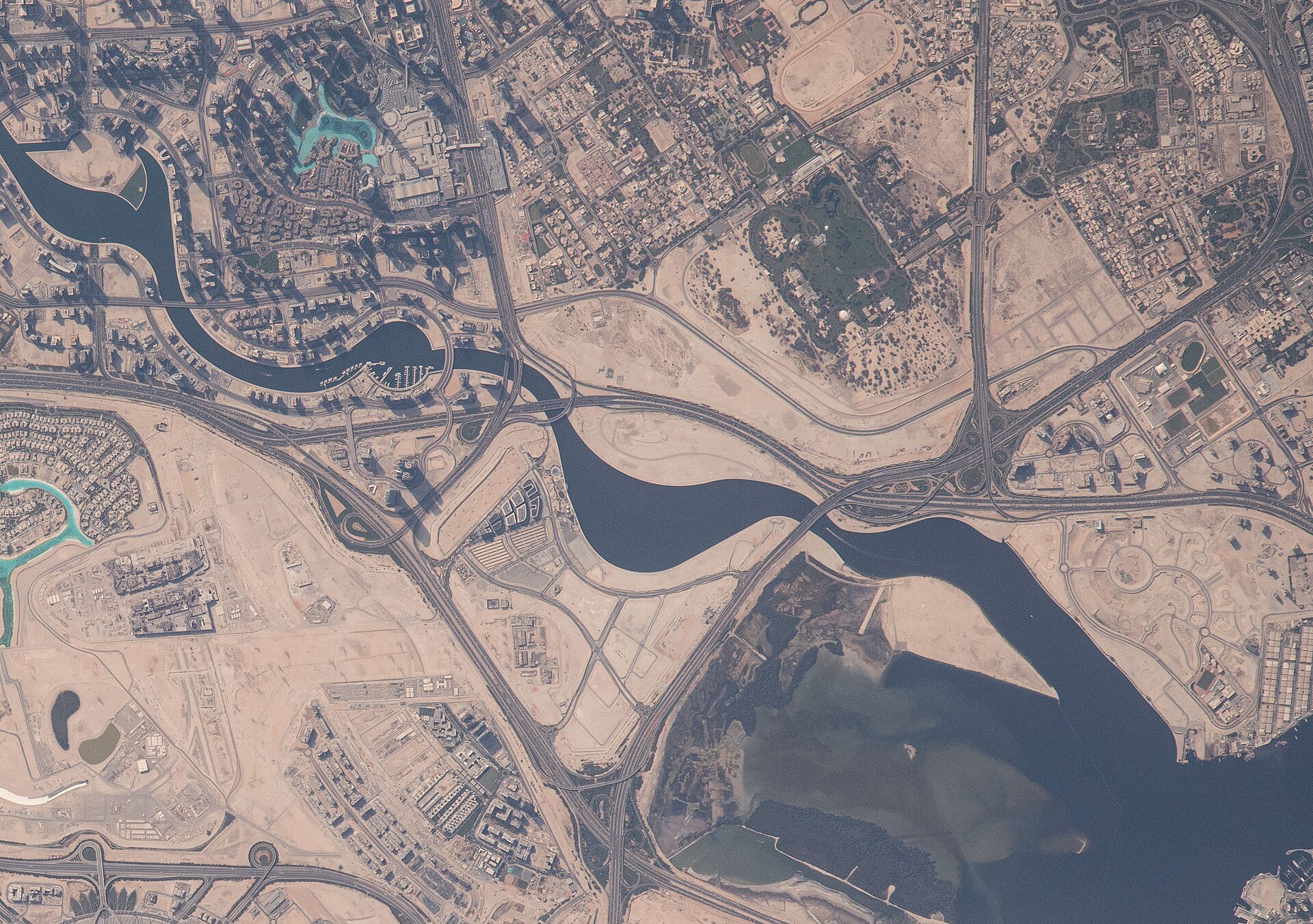View of Dubai taken during ISS Expedition 65. Dubai Water Canal, Business Bay, Ras Al Khor wetlands (Wildlife Sanctuary of upper Dubai Creek).